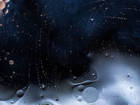 Colourful surreal psychedelic abstract liquid background. Water and oil drops with small air bubbles