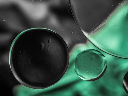 Colourful surreal psychedelic abstract liquid background. Water and oil drops with small air bubblesの写真素材