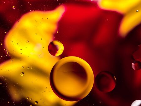 Colourful surreal psychedelic abstract liquid background. Water and oil drops with small air bubblesの写真素材