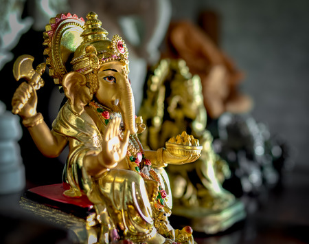 Little Golden Lord Ganesha adorn with Gemstonesの写真素材