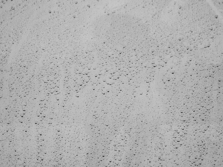 Dirty Water Stain Texture Background of Raindrops and Reflection Lighting on White Car Engine Hoodの写真素材