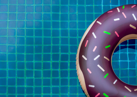 Pool Float Ring are Floating on Swimming Pool Background, Summer Conceptの写真素材