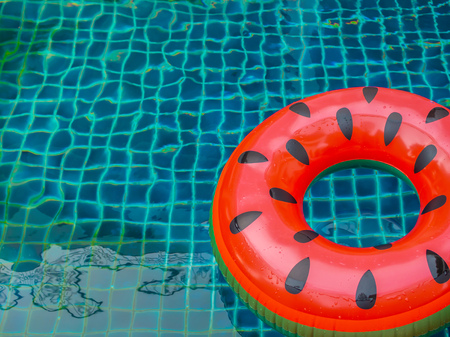 Pool Float Ring are Floating on Swimming Pool Background, Summer Conceptの写真素材