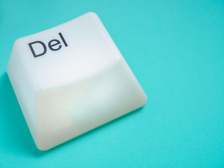 Big Delete Computer Key Button Light Box Isolated on Aqua Blue or Green Background with Space. Eraser Concept.の写真素材