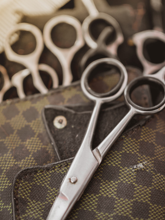 Scissors, Tools of Professional Barber for Hair Cut on Leather Pocketの写真素材