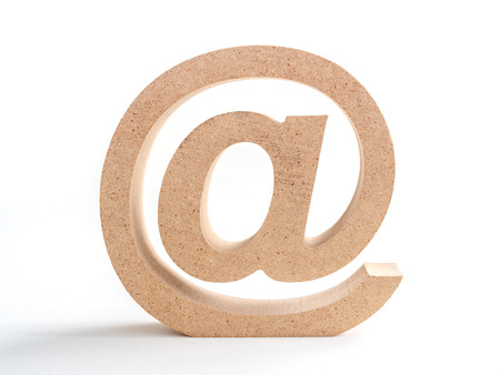 Wooden E-mail address symbol, arroba icon isolated on white background. E-mail marketing online internet concept.の写真素材