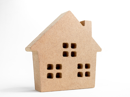 Wooden house isolated on white background. Property investment and family concept.の写真素材