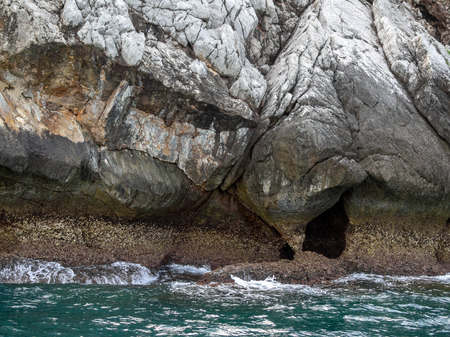 The rock cliff island mountain in the sea. Close-up stone Texture.の写真素材