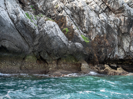 The rock cliff island mountain in the sea. Close-up stone Texture.の写真素材