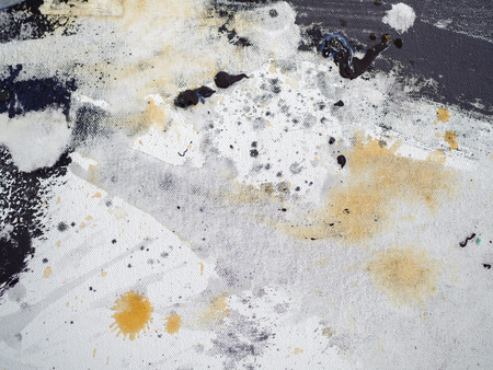 Abstract black, white texture and yellow splash acrylic art painting on white canvas background.の写真素材