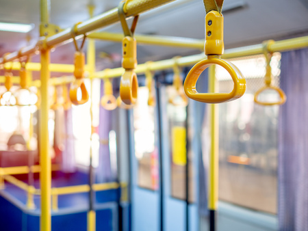 Yellow Handrail Holding Bar for standing passengers in the shuttle bus in the airport.の写真素材