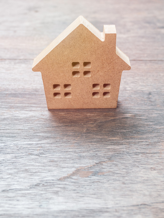 Wooden house on old wooden background with copy space vertical style.の写真素材
