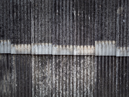 Old grunge ceramic roof tiles wall background and texture.の写真素材