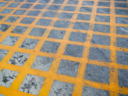 No parking cross yellow line on the ground. Yellow junction box on the road.の写真素材