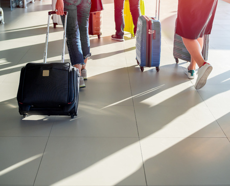 Traveller walking into the airport terminal with sunlight with copy space.の写真素材