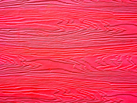 Red color painted on wooden wall texture background
