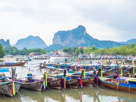 KRABI, THAILAND - NOVEMBER 3, 2018 - Many traditional travel long-tail boats parking Ao Nang port with seascape background at Krabi, Thailand.のeditorial素材