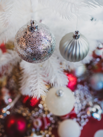 Christmas ornament decoration background. Christmas balls on white Christmas tree.の写真素材