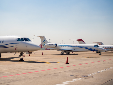 BANGKOK, THAILAND-November 5, 2018: Airplane parking outside the terminal near the runway in Don Muang Bangkok International Airport in Bangkok, Thailand on blue sky background.のeditorial素材