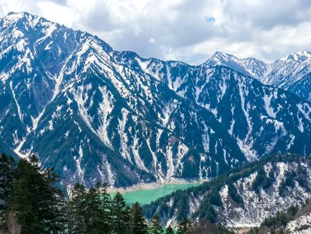 Beautiful snow mountain view with blue sky on Tateyama Kurobe alpine route, Japanese alps in Japan.の写真素材