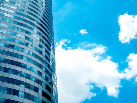 Bangkok, Thailand - June 22, 2019. Modern building, skyscrapers reflection blue sky and clouds with copy space. Abstract technology background.のeditorial素材
