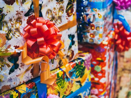 Colorful gift box background. Cute present boxes with colorful bows and ribbons in happy new year party.の写真素材