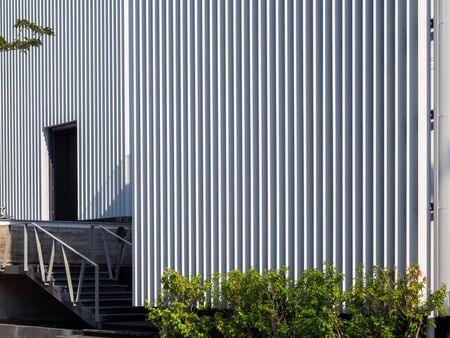 Modern white cutting-edge shipping container construction office building outdoor.の写真素材