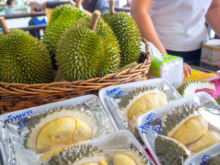 Bangkok, Thailand - April 14, 2020: Durian in basket and packaging for sale at street food market in Bangkok, Thailand.のeditorial素材