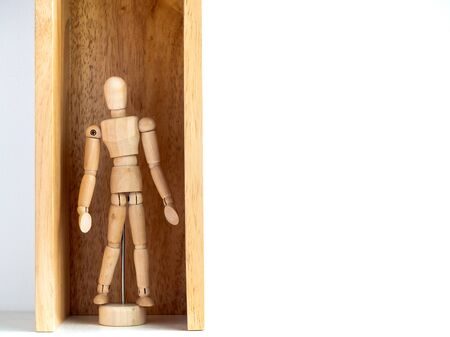 Stay safe, Wooden figure inside wooden box with copy space. New normal after covid-19 pandemic concept.の写真素材