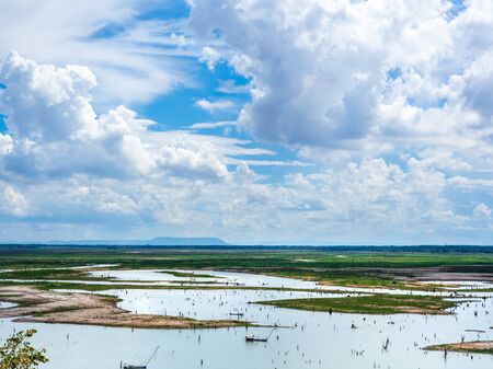 Beautiful cloud and blue sky with landscape of swamp background. Panoramic view of the countryside in Thailand.の写真素材