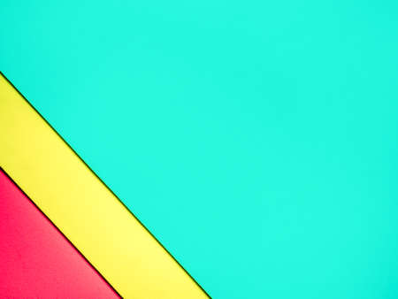 Multicolor cardboard background. Light green, yellow and red blank space.の写真素材