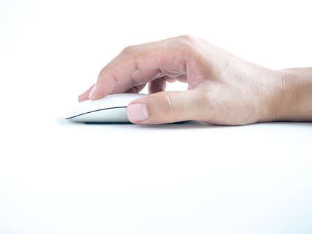Hand using computer mouse. Finger clicking on white modern mouse isolated on white background with...
