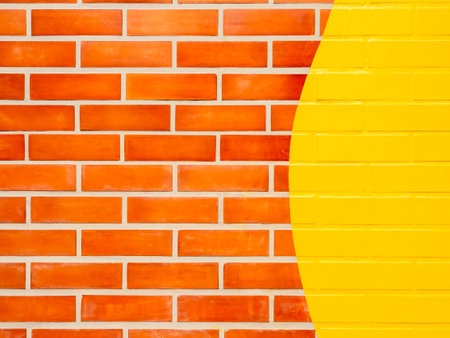 Brick wall background with yellow painted.
Empty space on vivid color brick wall texture.の写真素材