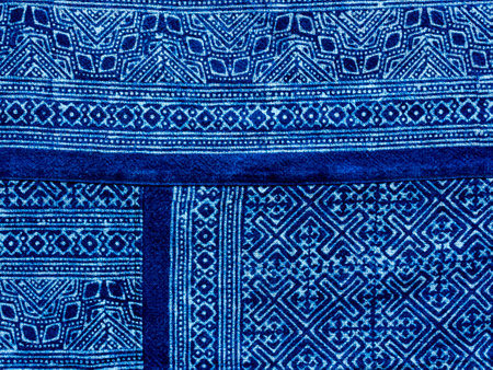 Indigo blue fabric tie dye pattern background. Indigo-Dyed fabric texture with abstract ethnic...