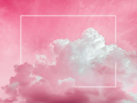 Blank rectangle white glowing light frame on dreamy fluffy cloud with aesthetic red neon sky background. Abstract minimal natural luxury background with copy space.の写真素材