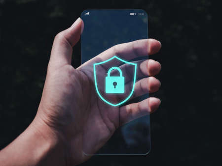 Smartphone security and privacy concept. shield and lock icon graphic on screen of very thin...