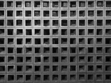 Square concrete block pattern, wall background. Light weight hollow brick block wall structure made from cement.の写真素材