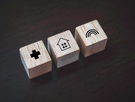 Stay safe concept. Home, health care, and rainbow icon on wooden blocks on wooden background. Stay...
