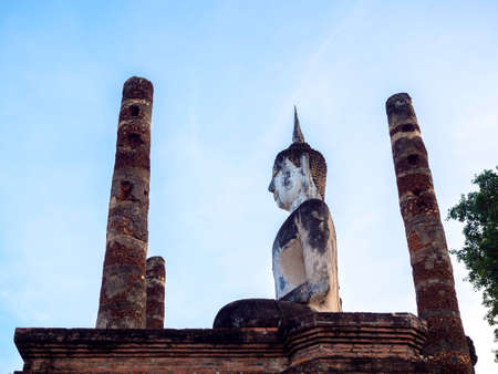 Amazing scenetic of Wat Mahathat Temple in the precinct of Sukhothai Historical Park with big buddha statue and old ancien constructure, a UNESCO World Heritage Site in Thailand.のeditorial素材
