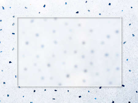 A transparent glass square border frame on white floor with many blue pieces of stones texture surface background, top view.の写真素材