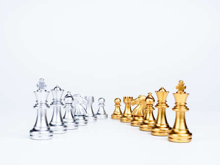 Set of luxury golden and silver chess pieces isolated on white background. The photo of rows of silver and gold chess, king, rook, bishop, queen, knight, and pawn.の写真素材