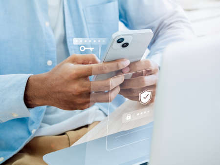 Two factor authentication or 2FA concept. Virtual key icon while access on phone with laptop for...