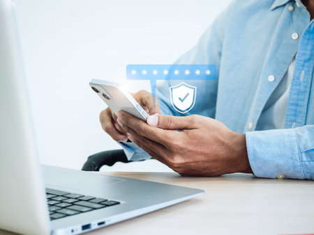 Two factor authentication concept. Virtual safety shield icon while access on phone with laptop for validate password, Identity verification, cybersecurity with biometrics authentication technology.の写真素材