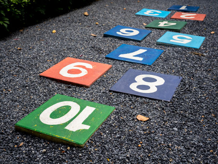 Number 10, the last steps for the goal on multicolored hopscotch on the asphalt ground in the kids playground with nobody, outdoors game activities for children. Growth and education concept.の写真素材