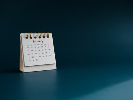 A January 2023 calendar desk for the organizer to plan and reminder isolated on blue background, minimal style with copy space. White small table calendar with first month page, Happy new year 2023.の写真素材