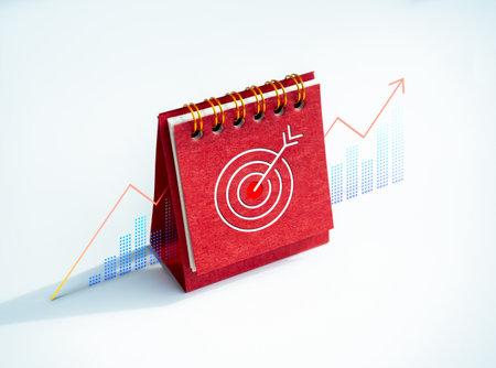Target icon on red desk calendar cover standing with business growth graph chart on white background. Business goals and success, action plan, leadership, and investment concepts.の写真素材
