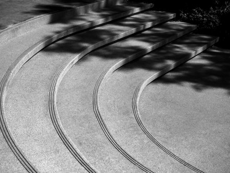 Outdoor curvilinear stone stairs in black and white style. Abstract curve shape of modern stairs...
