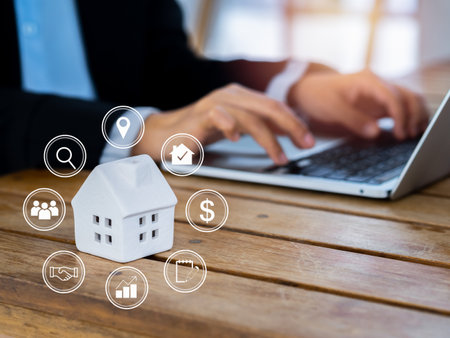 Property value, home investment, real estate online market and house selection concepts. Property valuation diagram with icons virtual near white miniature house with business people using laptop.の写真素材