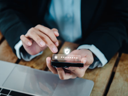 Two steps authentication (2FA) concept. 2023, Shield and asterisk icons code showing on smart phone while using computer for validate password, Identity verification, cyber security technology.の写真素材