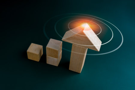 Target icon symbol on arrowhead wooden on cube blocks bar graph chart steps on dark blue background, top view. Investment, income, trends, inflation, business growth, economic improvement concepts.の写真素材